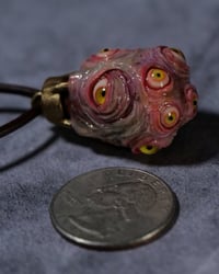 Image 1 of Egg of the King pendant, leather cord, brass hardware, all seeing glowing eyes