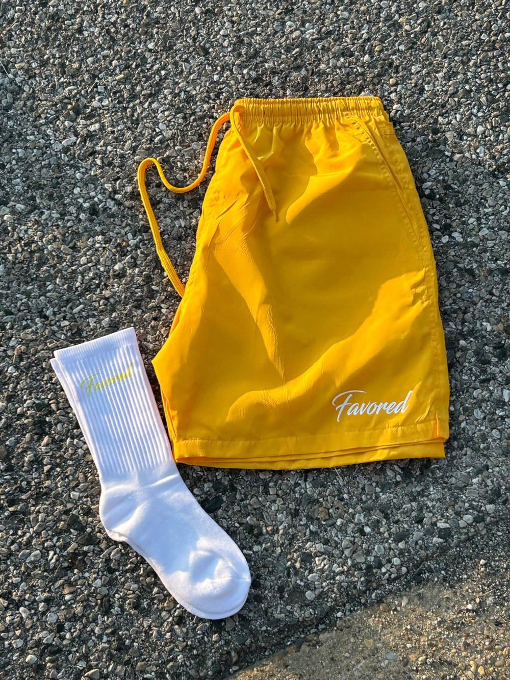 Image of FAVORED Yellow Nylon Winbreaker Shorts