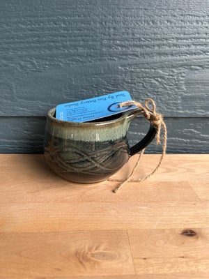 Image of M44 small mug with dark speckled glaze, round belly