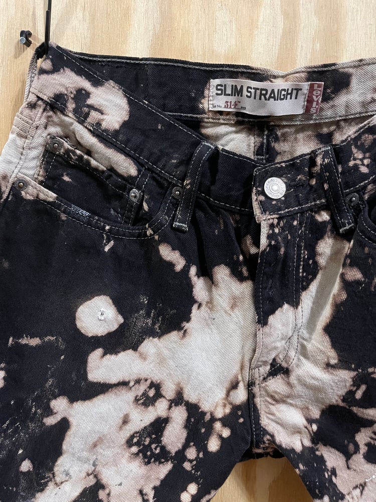 Image of Black splattered Levis 