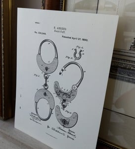 Image of print of handcuffs from 1880