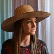 Image of wide brim beach hat 