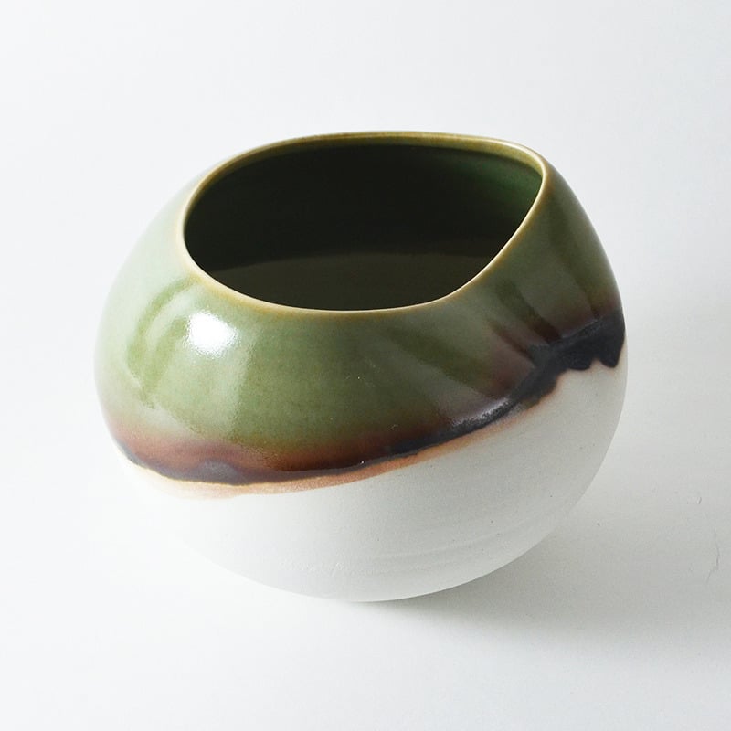 Image of altered porcelain globe bowl