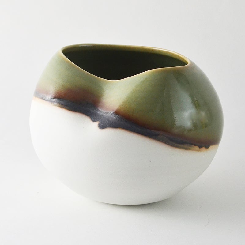 Image of altered porcelain globe bowl