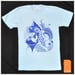 Image of - Tsunami Fish Design on a Light Blue Unisex American Apparel T Shirt
