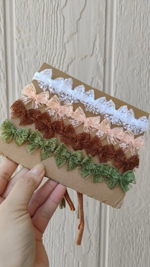 Image of Multiple bows Tieback