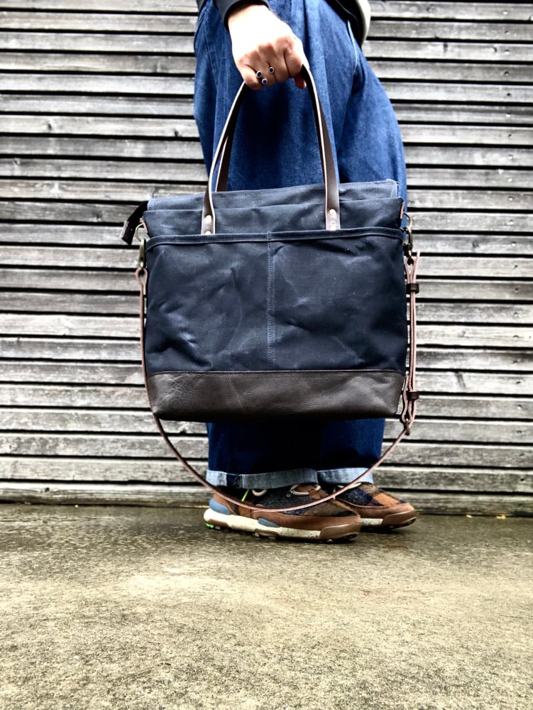 Image of Black Waxed canvas carryall with handwoven exterior pocket 