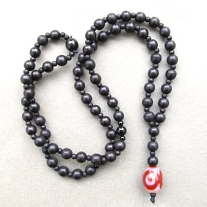 Image of Black Beaded Necklace With Decorative Glass Bead