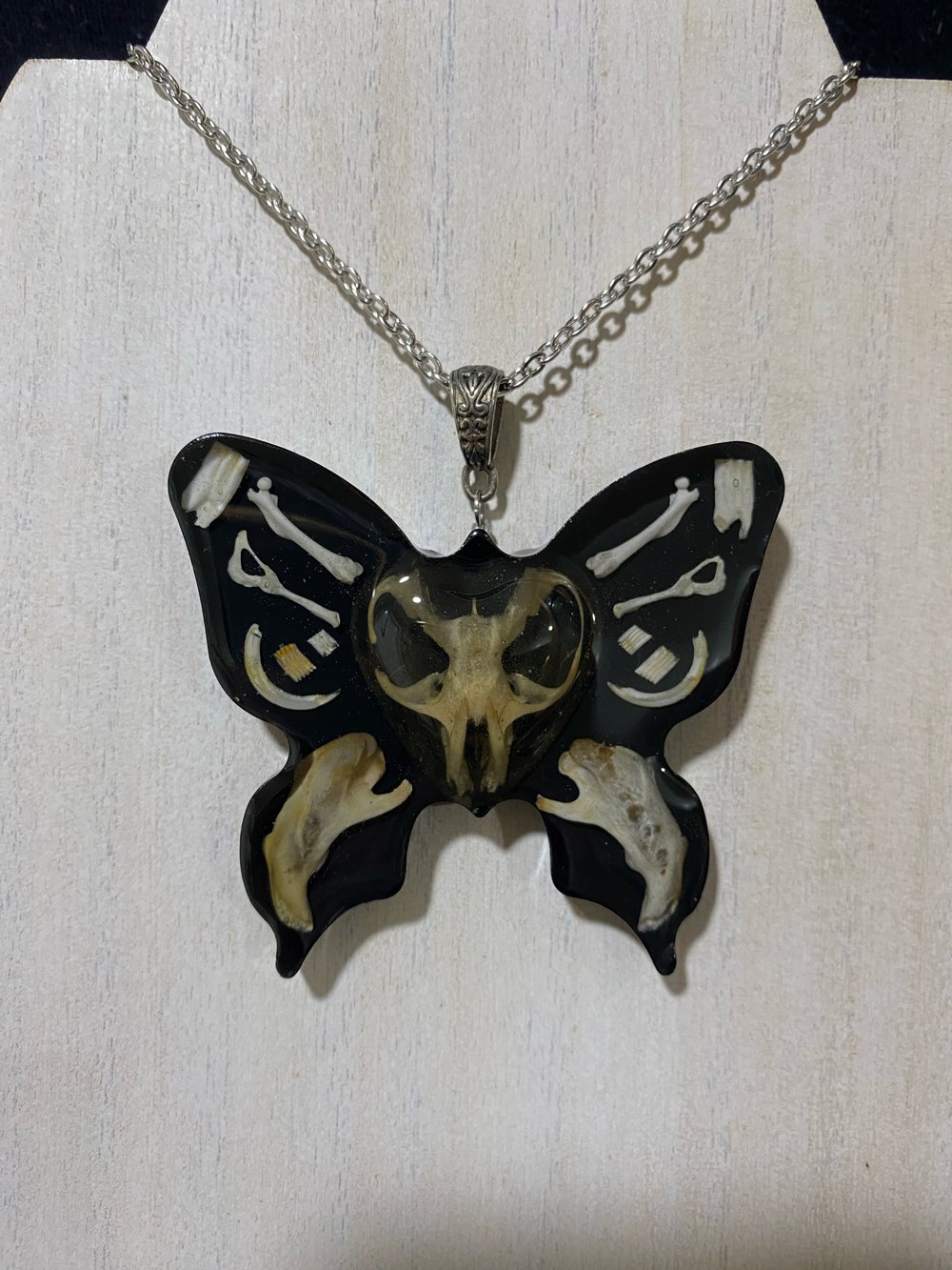 Butterfly skull pendant