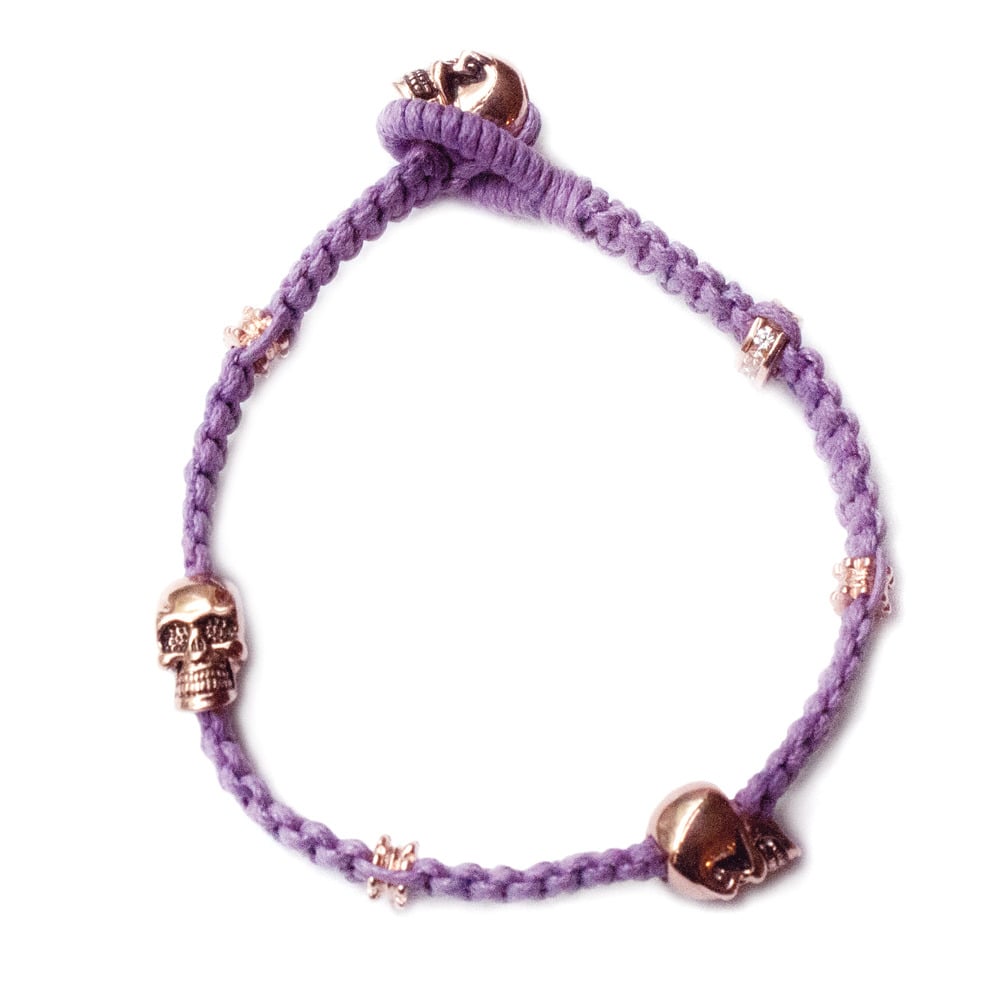 Image of 'Don't lose your head' bracelet, Bitten lip lavender with rose gold skulls