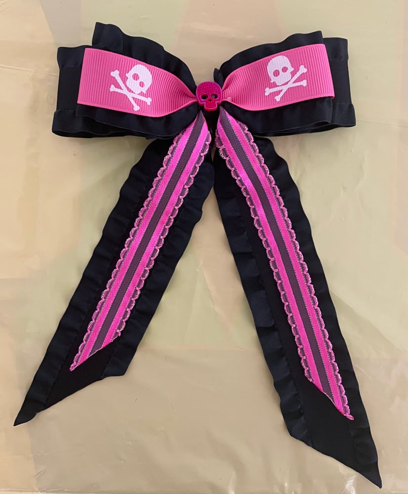 Pink and black skull bow with tails