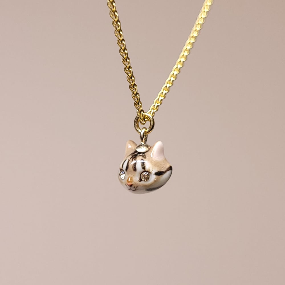 Image of Brown Tabby Porcelain & Gold Vermeil Teeny Tiny Cat Pendant