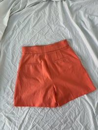 Image 2 of Orange shorts // 38