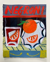 Negroni with plate of oranges on navy stripes