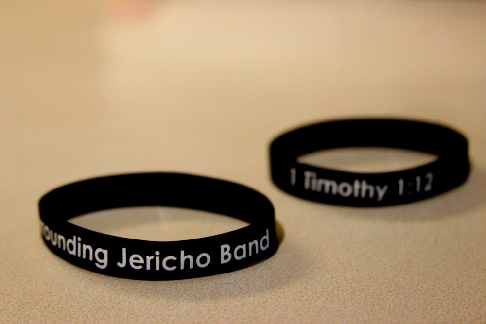 Image of Black w/ White lettering Wristband