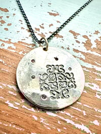 Image 1 of sapphire pendant with hand engraved Shakespeare quote