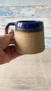 Image 2 of Blue rimmed mug.