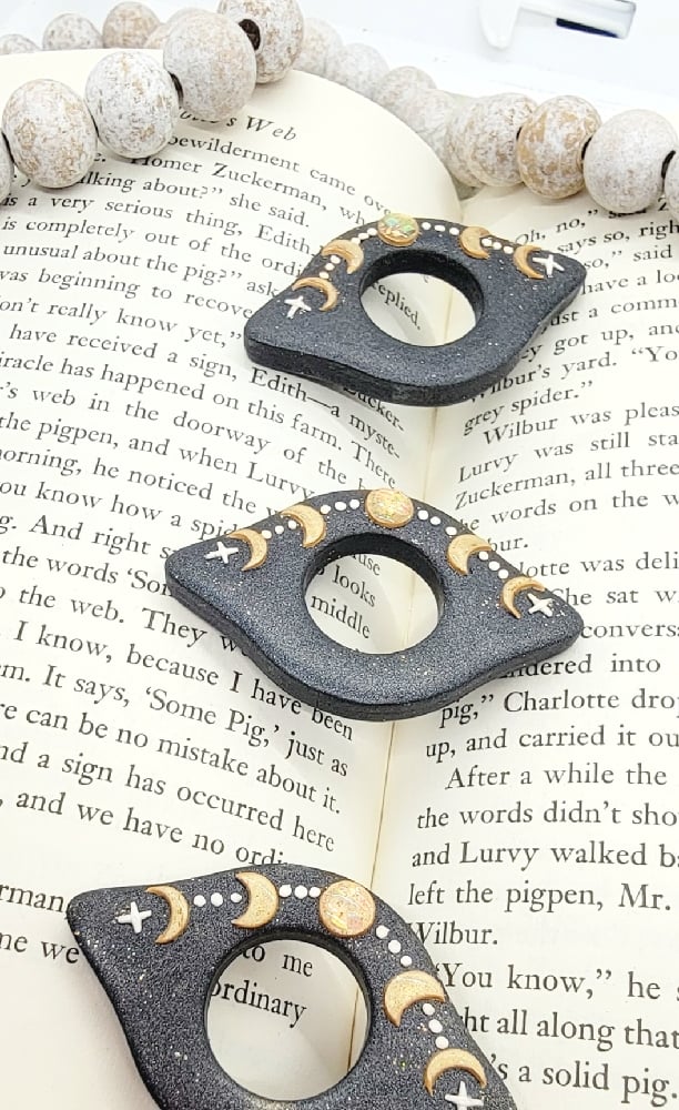 Image of Celestial Thumb Grip Page Holder