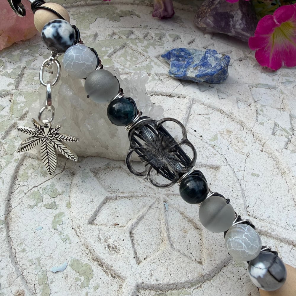 Image of obsidian petals roach clip