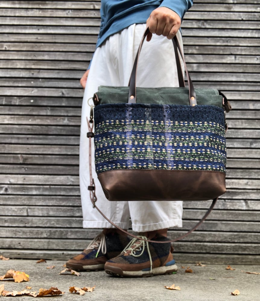 Image of  Waxed canvas carryall with handwoven exterior pocket in forest green