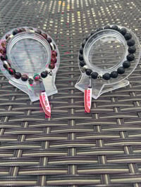 Image 2 of Men’s Halloween bracelet made with lava stone beads and knife charm 