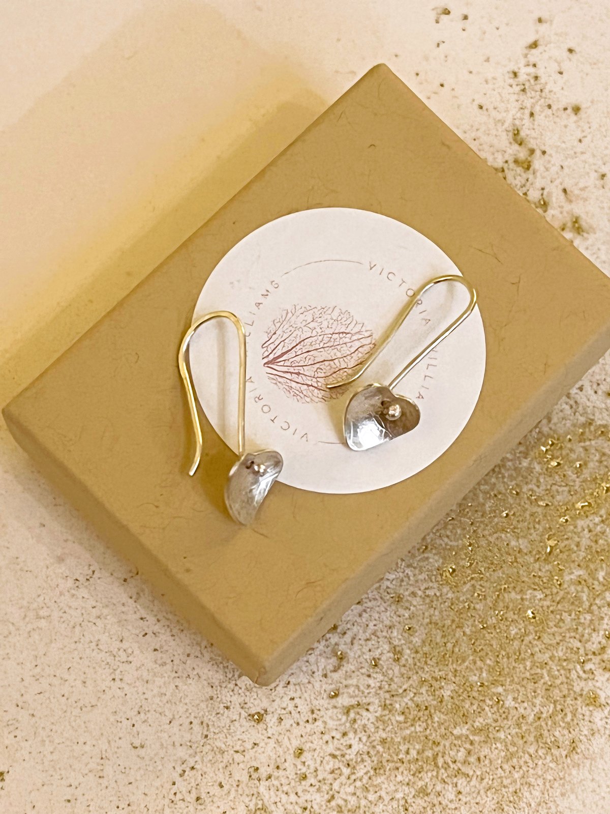 Image of Recycled sterling silver heart drop earrings.