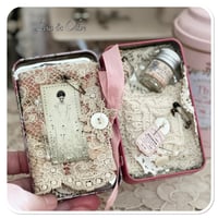 Image 1 of A Petite French tin with a needle book and tattered pin cushion