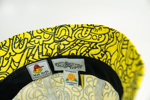 Image of Head Hugs-yellow with thin black 