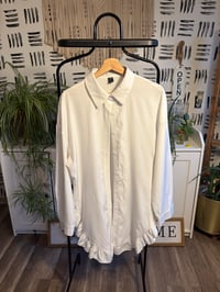 Image 1 of White ruffle bottom top 