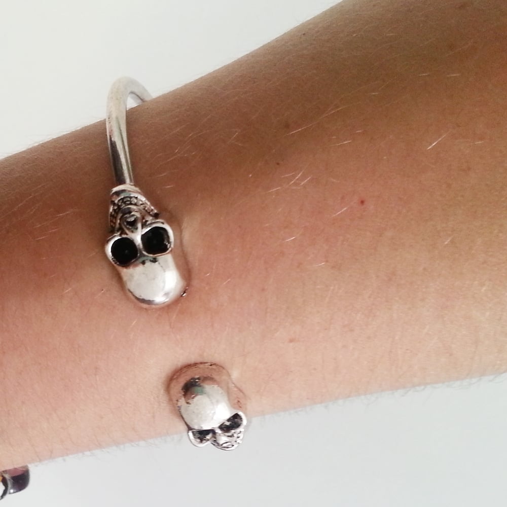 Image of Silver toned skull bangle