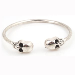 Image of Silver toned skull bangle
