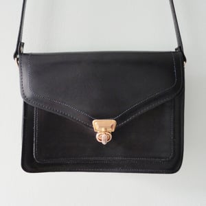 Image of Navy blue leather handbag with long strap