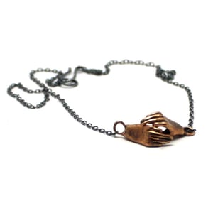 Image of Cast Bronze Holding Hand Necklace