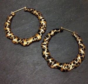 Image of Gold and black print hoops