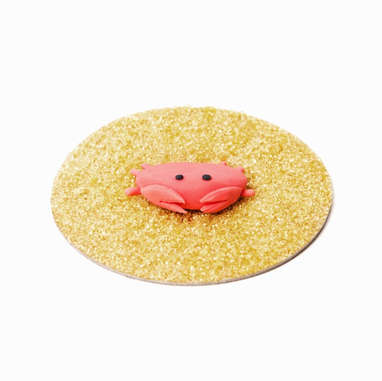 Image of crab on "sand"
