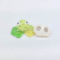 Image 1 of Sad zombie frog on lily pad with ghost mask ceramic figurine 