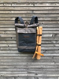 Image 1 of Backpack in waxed canvas with detachable leather side straps and padded shoulder straps