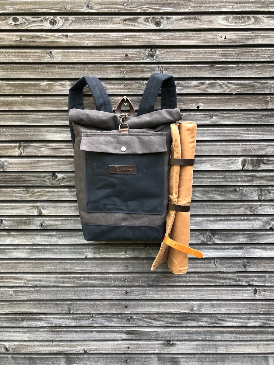 Image of Backpack in waxed canvas with detachable leather side straps and padded shoulder straps