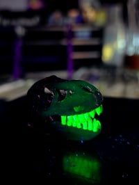 Image 5 of Royal jelly mini T-Rex skull pendant with uv reactive teeth 💜 