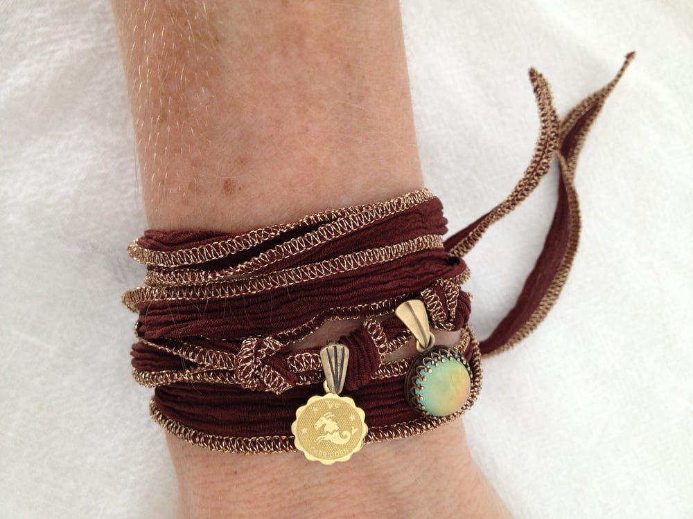 Image of CAPRICORN Zodiac Silk Wrap Charm Bracelet with Color Changing Cabochon