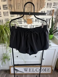 Image 1 of black short parachute shorts