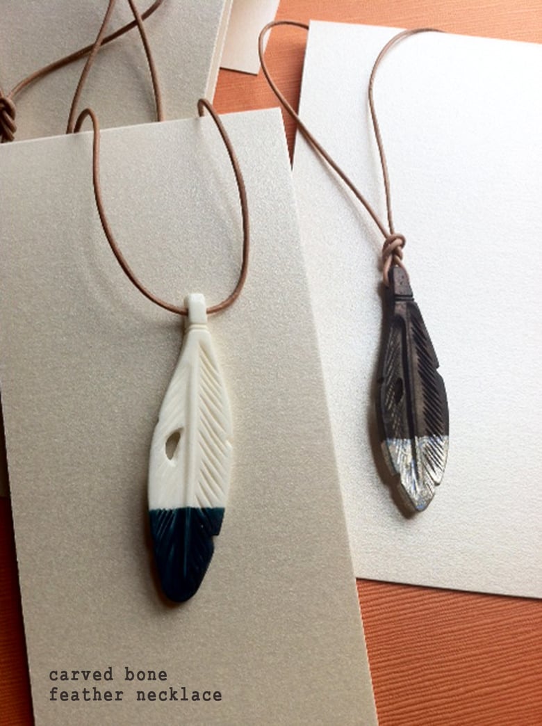 Image of carved bone feather necklace