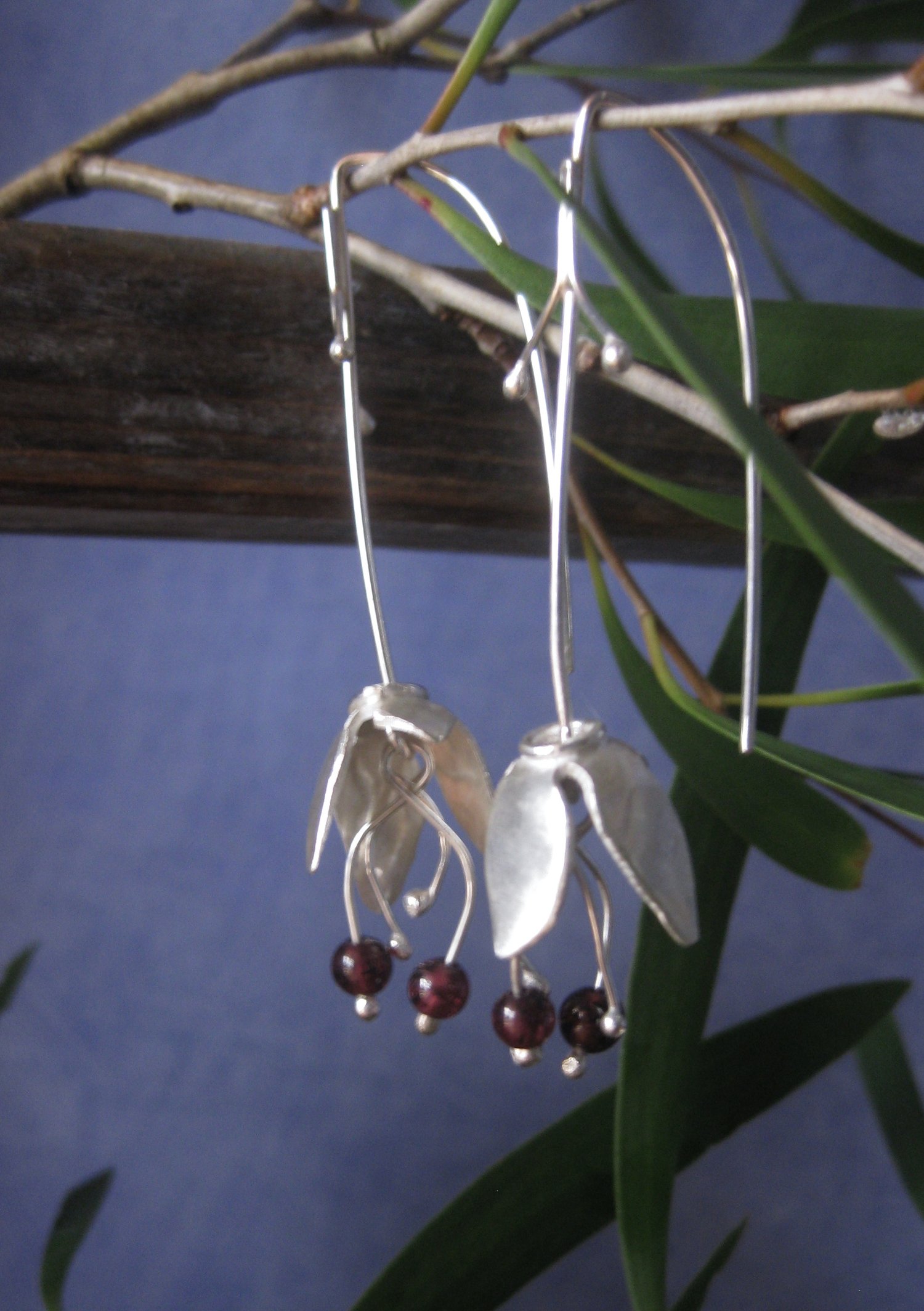 Image of Forged sterling silver bell flower hooks with garnets