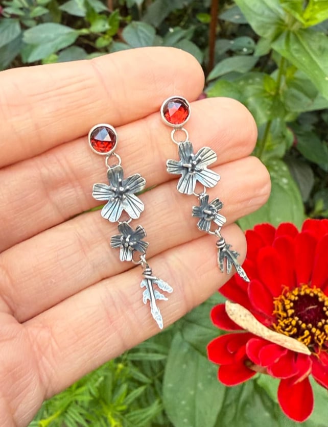 Image of Tiered Signet Marigold Flowers Leaves Garnet Stud Earrings