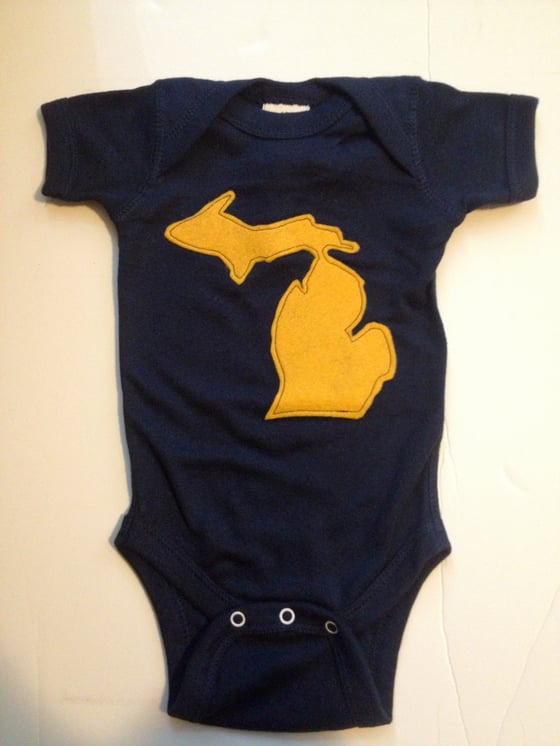 Image of navy and gold Michigan onesie