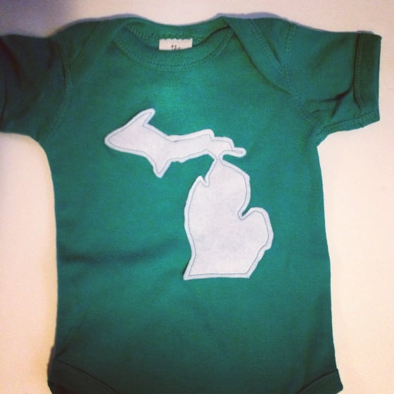 Image of green and white Michigan onesie
