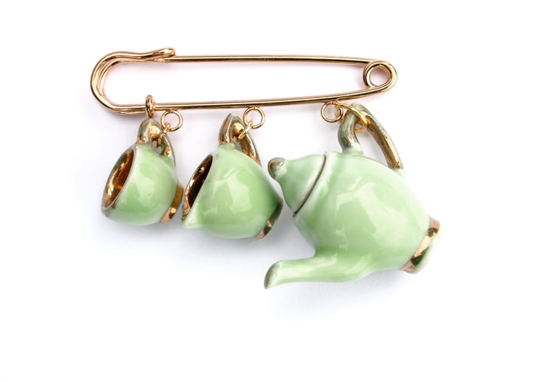 green and gold kilt pin