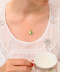 Image 1 of green cup and saucer necklace
