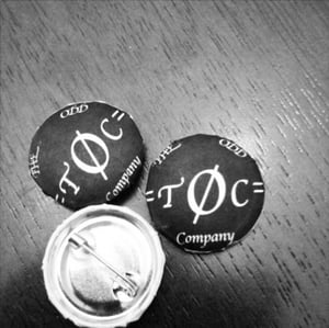 Image of The Odd Company's Logo on Buttons