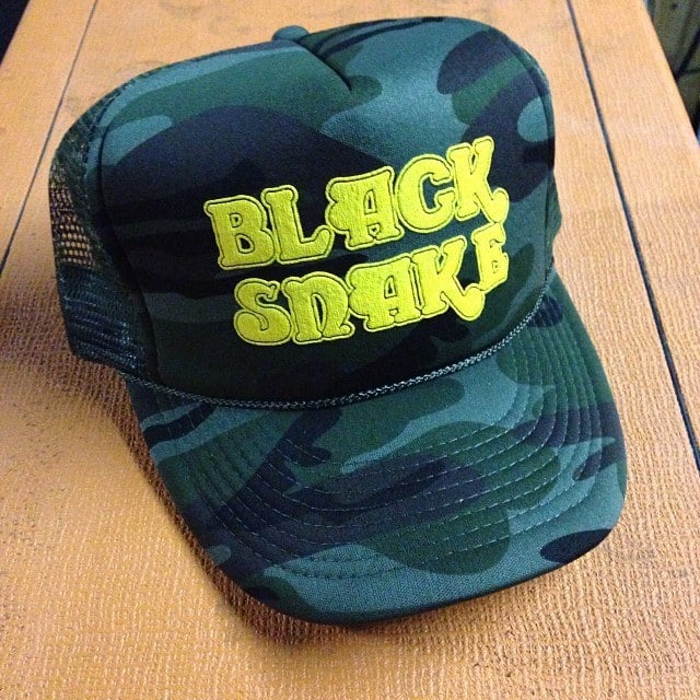 Image of Black Snake camo trucker hat